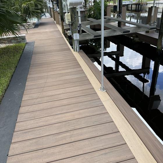 Long Brownstone vinyl walkway with picture framing along the canal