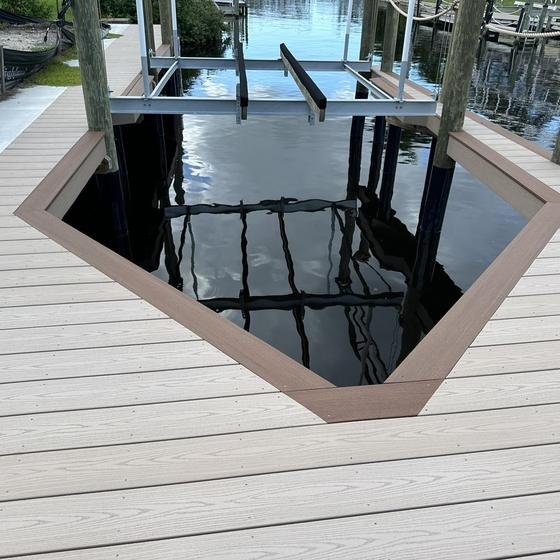 Angled boat slip in Slate Gray vinyl decking with Brownstone picture framing