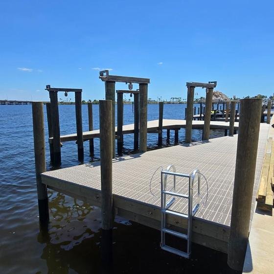 Riverfront dock with grated decking and stainless ladder